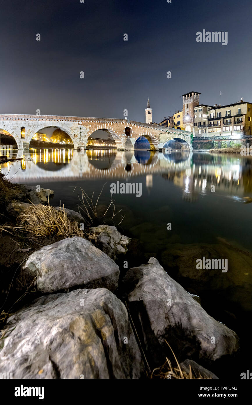 Verona: the Pietra bridge reflected in Adige River. Veneto, Italy ...