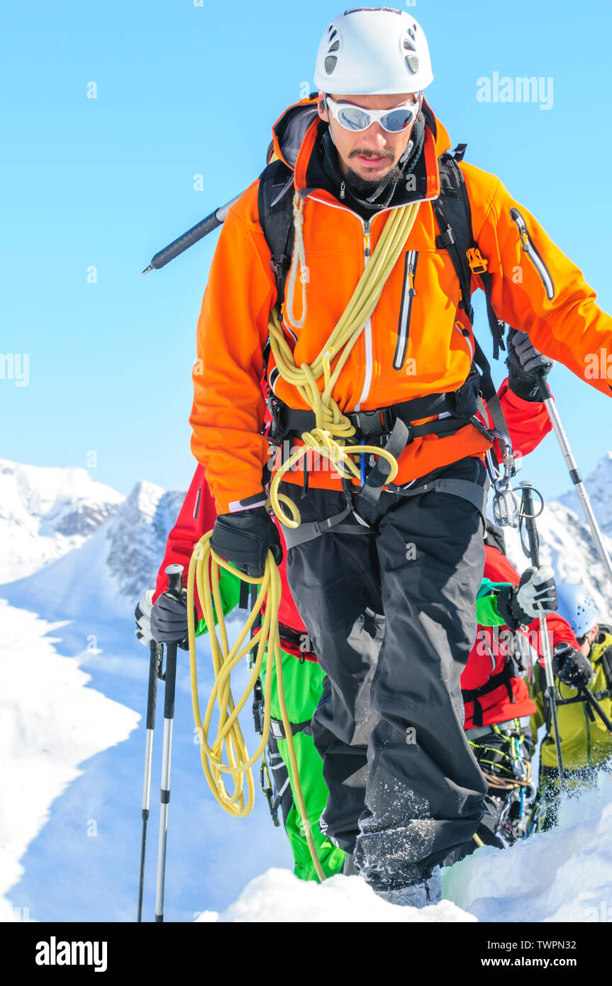Mountain guide leading a group of alpinists up to Monte Rosa Glaciers