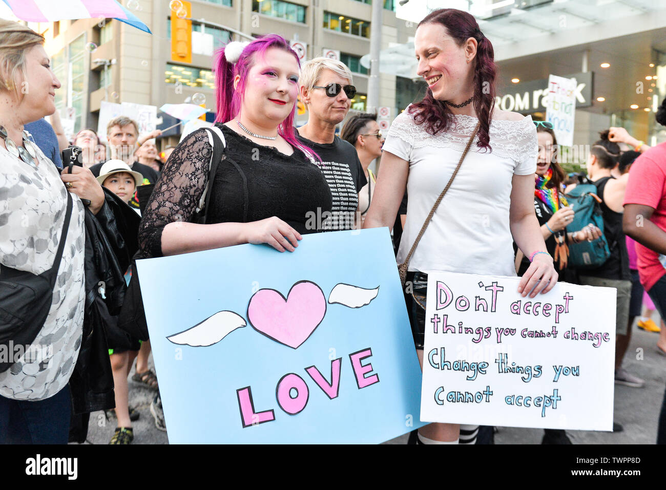 Protesters hold placards during the Trans march.Spectators displayed their support towards the transgender and non-binary people while demonstrating on the streets of Toronto in a Trans March during the Pride Month. Stock Photo