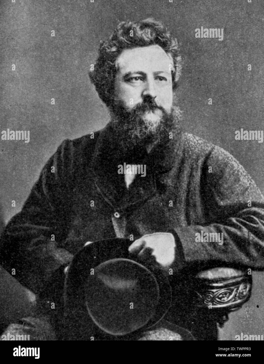 William Morris (1834-1896). From a albumen cabinet card by Elliott & Fry, 21st March 1877. Morris was an English textile designer, artist and writer. The prominent socialist was closely associated with the Pre-Raphaelite Brotherhood and English Arts and Crafts Movement. Stock Photo