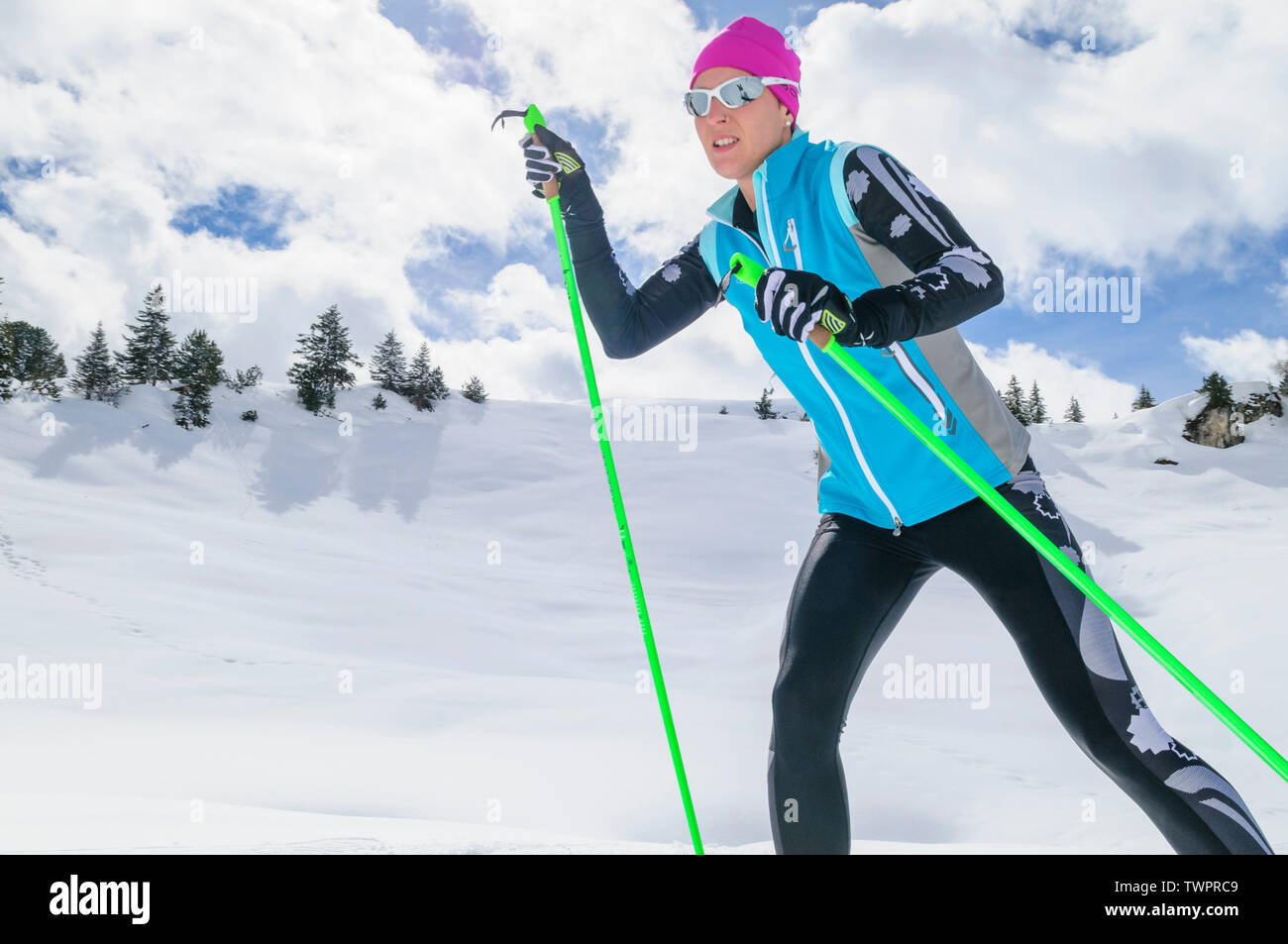 Couple during cross-country skiing exercise in skating style in austrian mountains near Warth Stock Photo