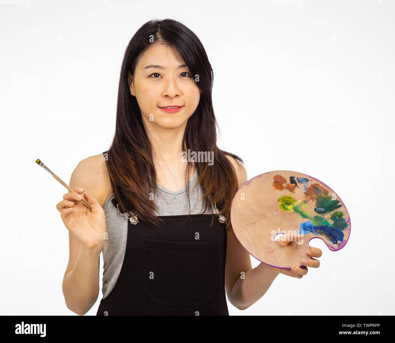 Artist holding painting palette and brush Stock Photo Alamy