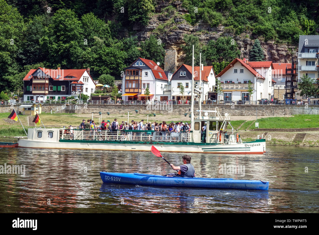 Man canoeing Elbe River, Kurort Rathen, Saxon Switzerland, Saxony, Germany Stock Photo