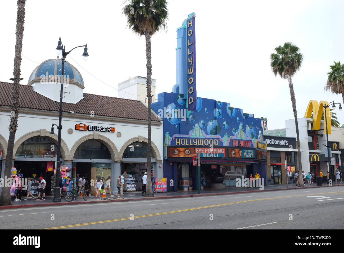 HOLLYWOOD - CALIFORNIA: JUNE 18, 2019: Hollywood Boulevard street scene with shops, theaters and tourists in the Walk of Fame District. Stock Photo