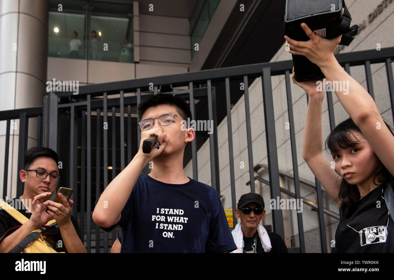 Joshua Wong, co-founder of the Demosisto political party, and Agnes Chow at the police headquarters. Despite the Chief Executive Carrie Lam's attempt to ease the heightened tension by agreeing to suspend the controversial extradition bill, student groups and union has continue the protest against Hong Kong government. The protesters called for the withdrawal of the controversial extradition bill, the release and non-prosecution of the people arrested due to the cause, investigation of whether excessive force had been used by the police on June 12, and the resignation of Carrie Lam. Stock Photo