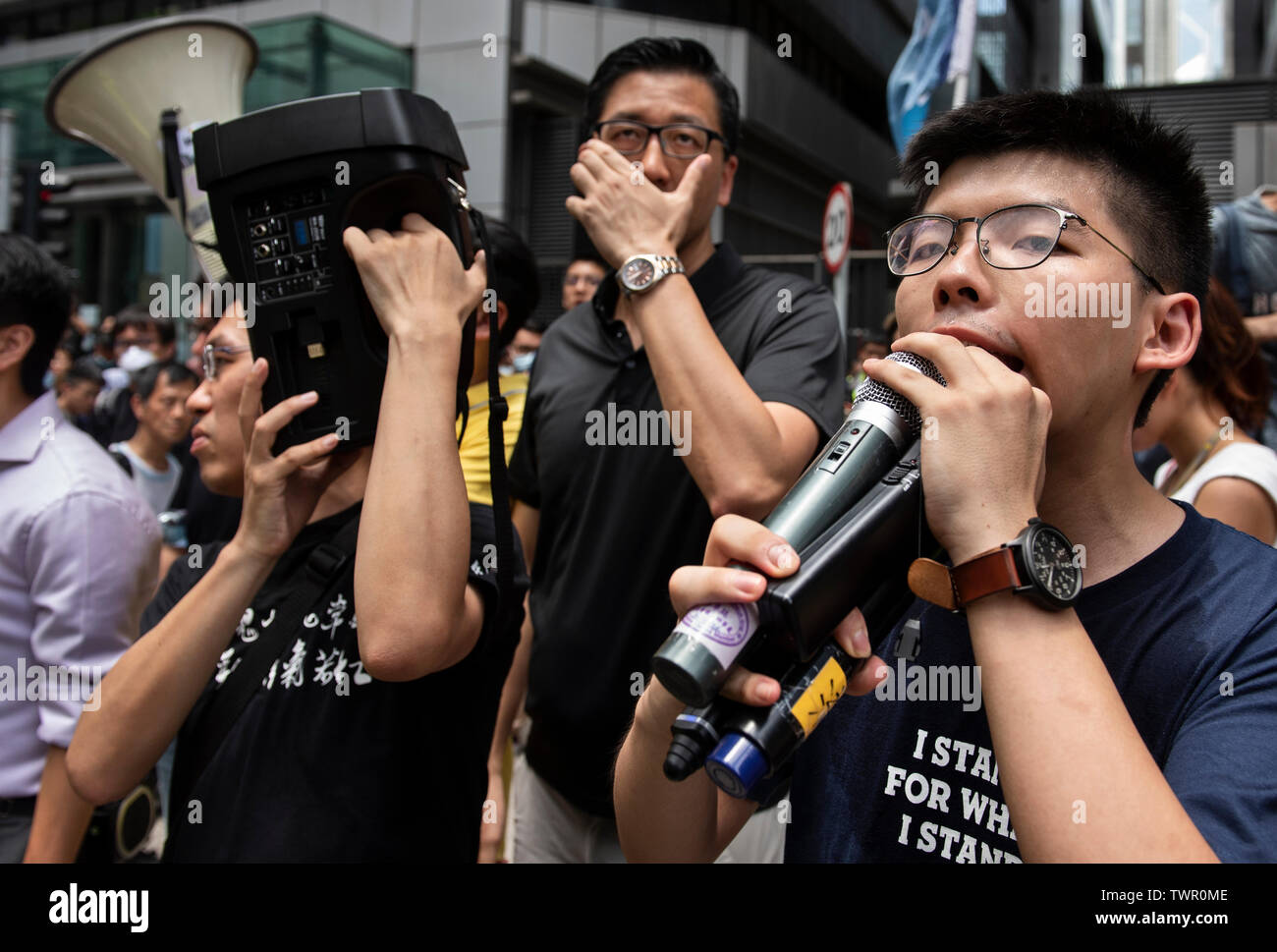 Joshua Wong, co-founder of the Demosisto political party, speaks to the protester gathered at the police headquarters. Despite the Chief Executive Carrie Lam's attempt to ease the heightened tension by agreeing to suspend the controversial extradition bill, student groups and union has continue the protest against Hong Kong government. The protesters called for the withdrawal of the controversial extradition bill, the release and non-prosecution of the people arrested due to the cause, investigation of whether excessive force had been used by the police on June 12, and the resignation of Carri Stock Photo