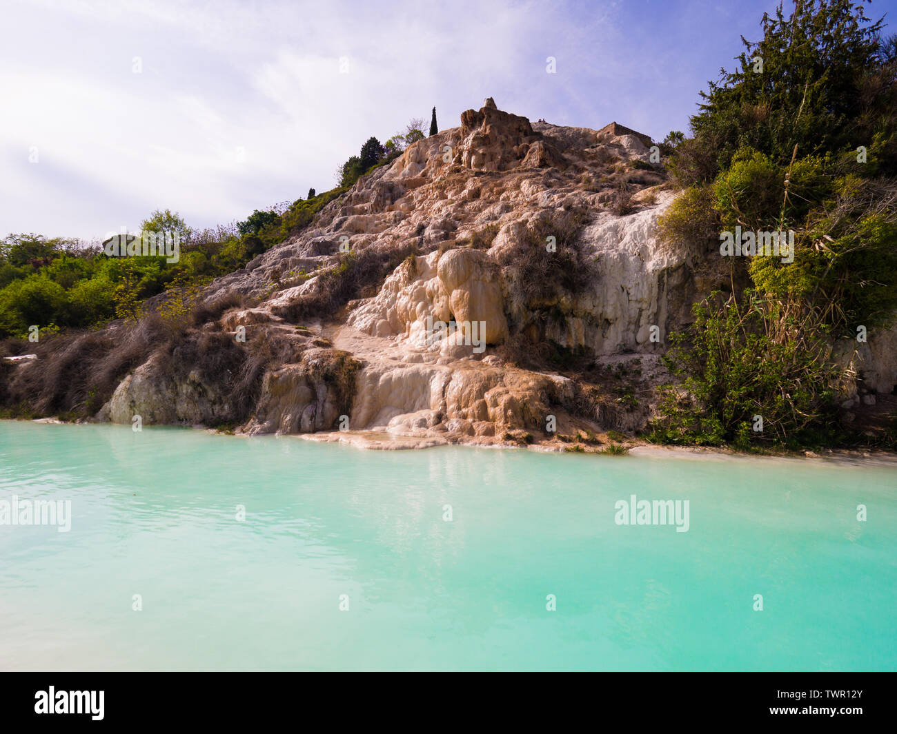 Natural swimming pool with thermal spring water in Bagno Vignoni, Italy. Stock Photo
