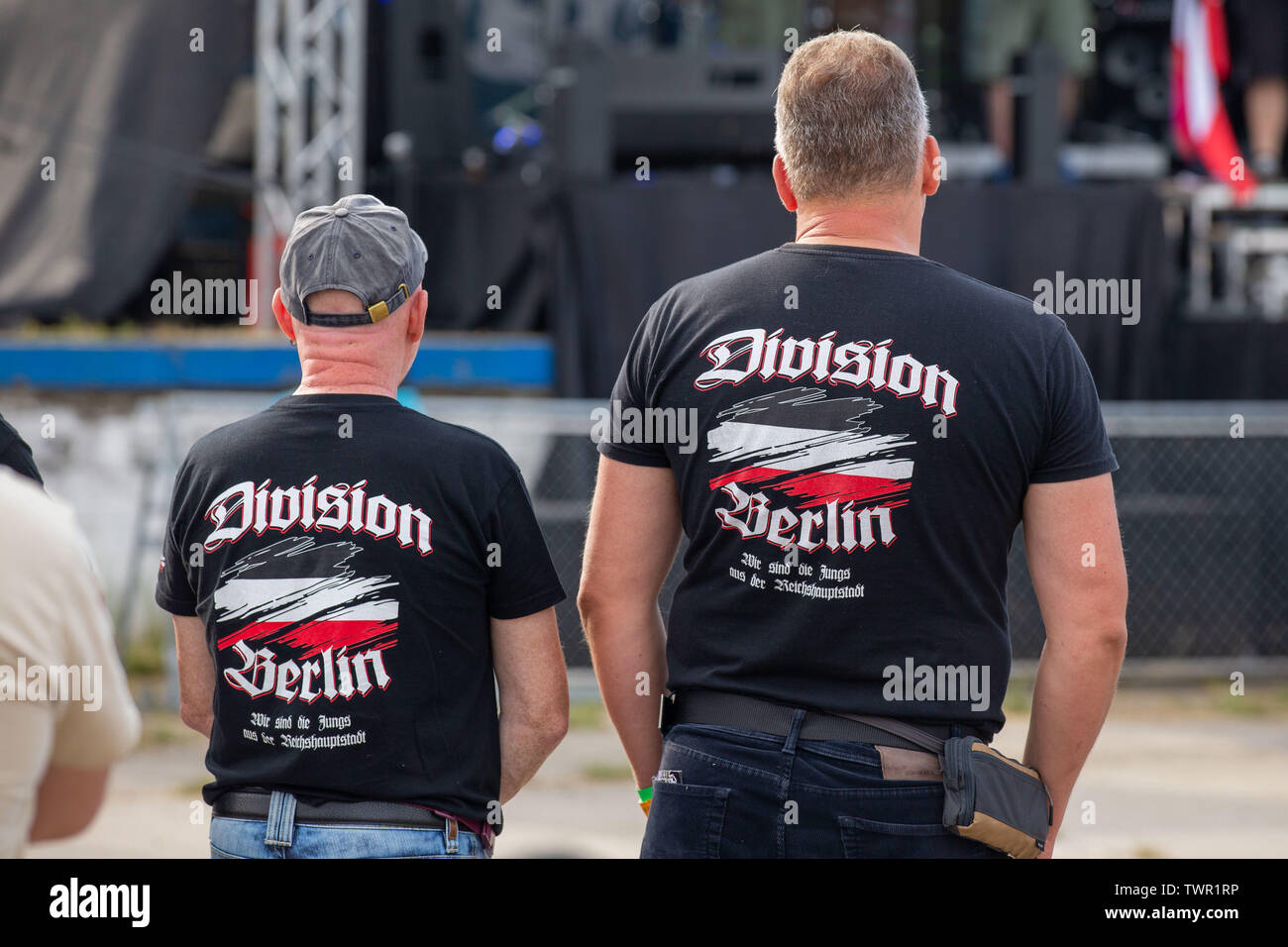 Ostritz, Germany. 22nd June, 2019. Two men stand in front of a stage on the  grounds