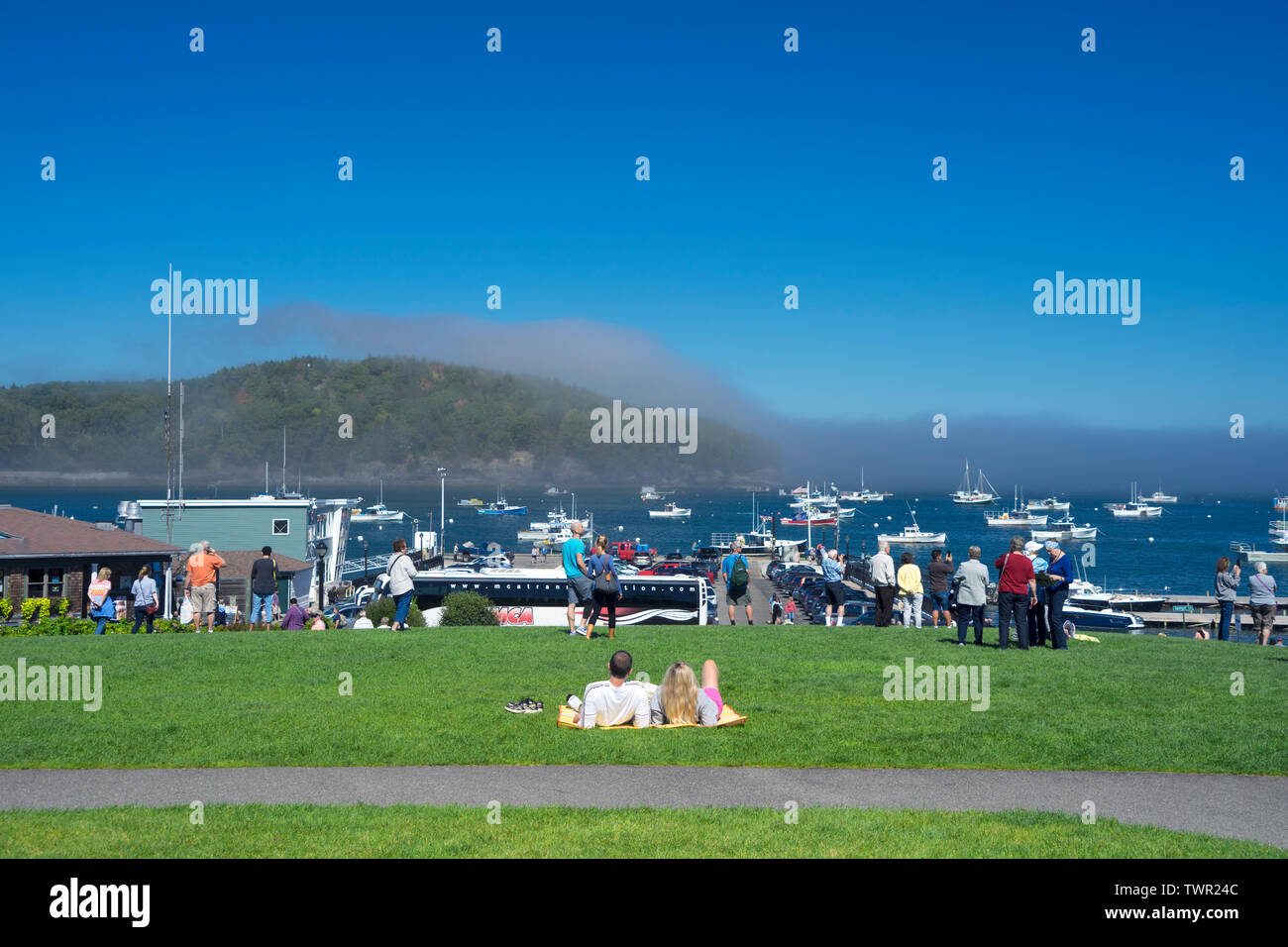 Couple relaxing on the lawn of Agamont Park, Bar Harbor, Maine, USA. Stock Photo