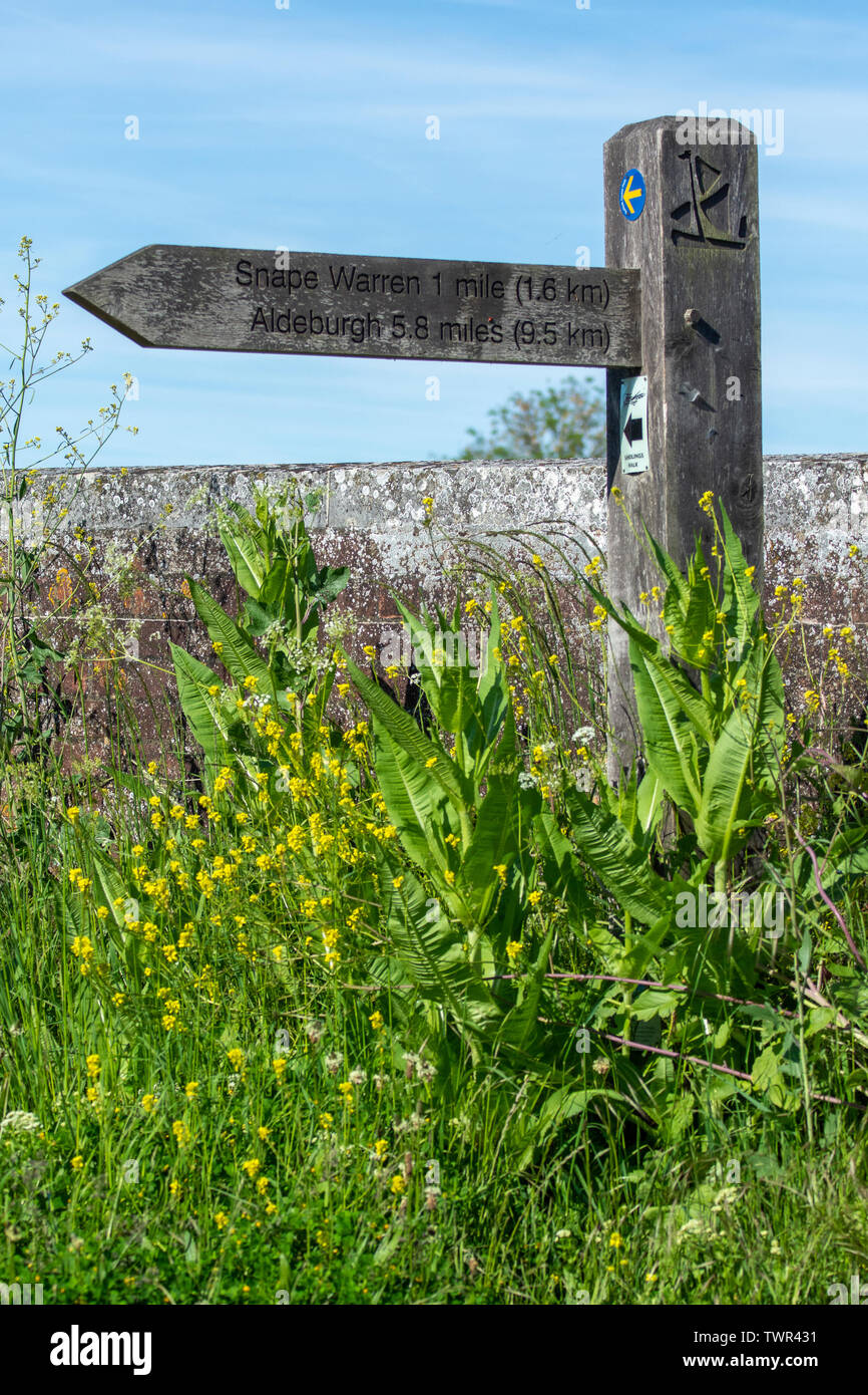 Public footpath sign for Snape Warren and Adleburgh at Snape Maltings Stock Photo