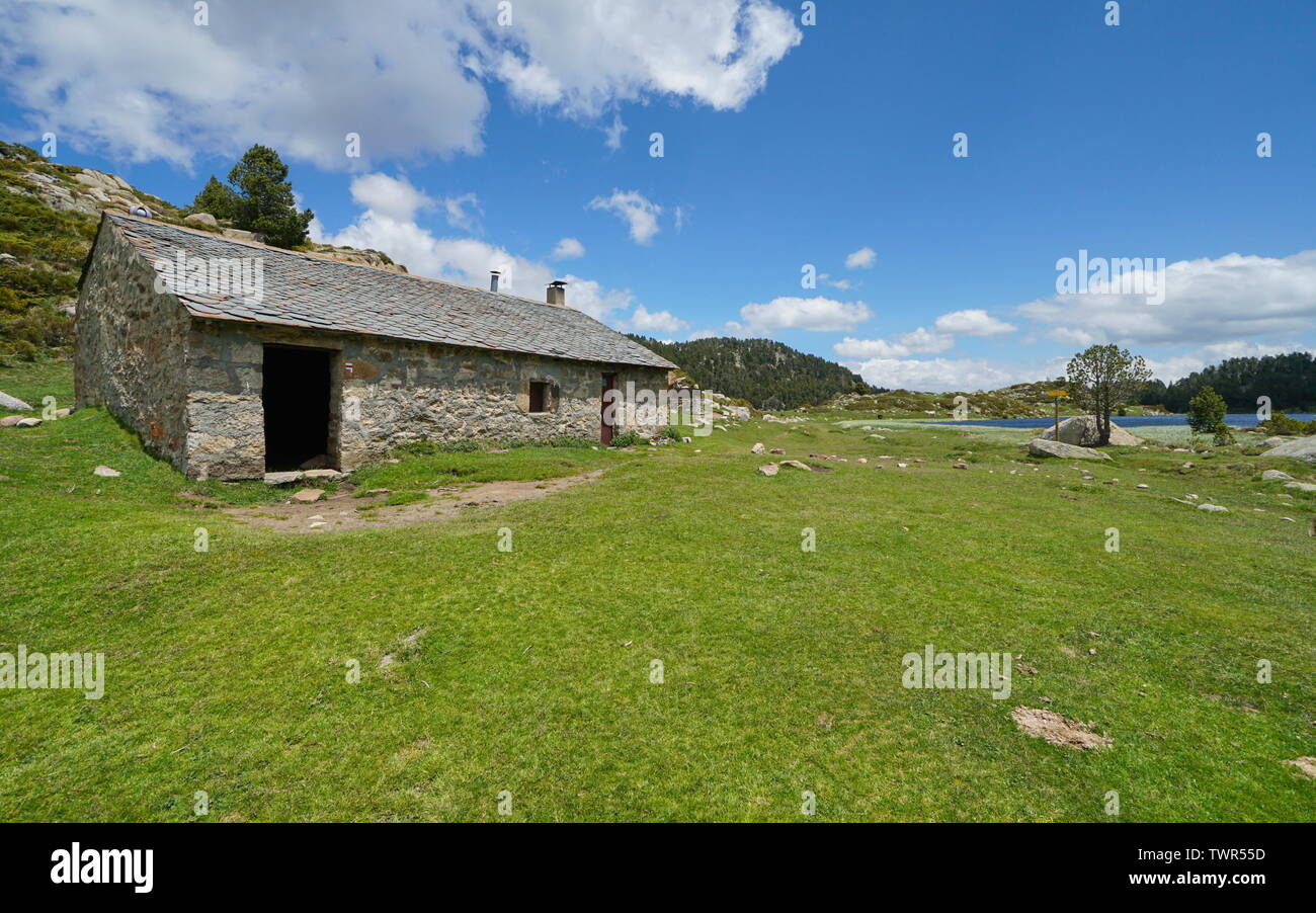 Refuge in the mountain near a lake, Pyrenees-Orientales, France, natural park of the Catalan Pyrenees Stock Photo