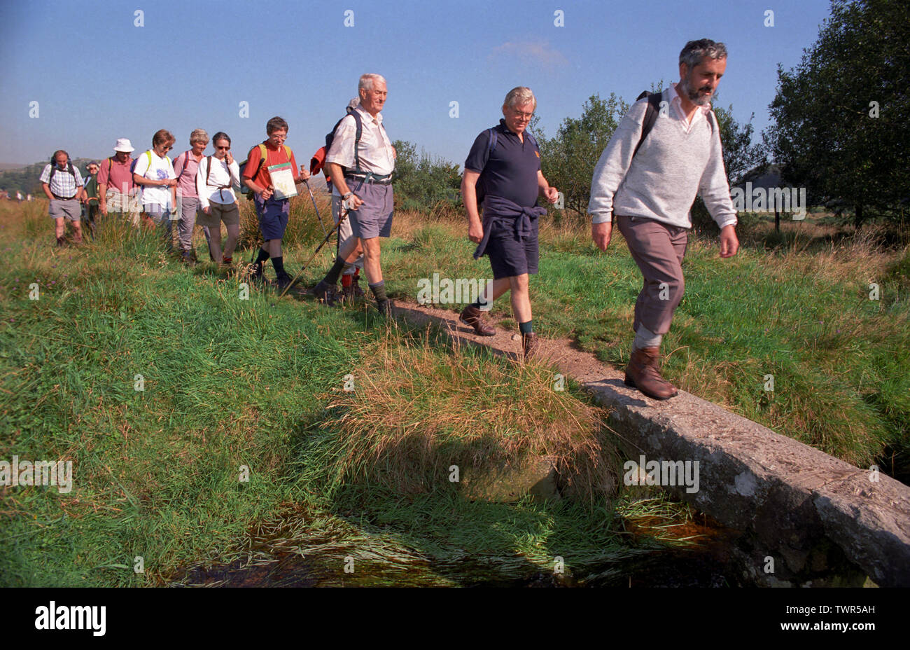 Dartmoor, Devon, England. Ramblers leave Postbridge on Dartmoor at the start of a mass ramble organised by the Rambler's Association. Stock Photo