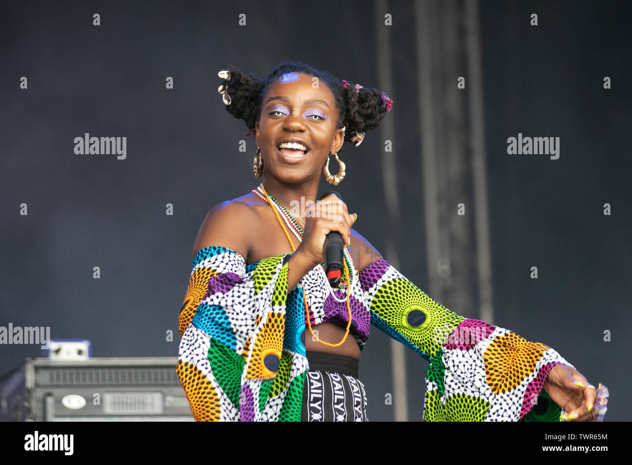 New York American R&B duo singers Niambi Sala and Thandiwe, who go by Niambi and Thandi, a hip-hop and soul duo from Washington, whose music is described as the 'sonic manifestation of Afro futurism, entertain the crowds in Sefton Park at the Liverpool Africa Oye event. Contemporary R&B is a music genre that combines elements of rhythm and blues, pop, soul, funk, hip hop and electronic music. The genre features a distinctive record production style, drum machine-backed rhythms, pitch & corrected vocals, Stock Photo