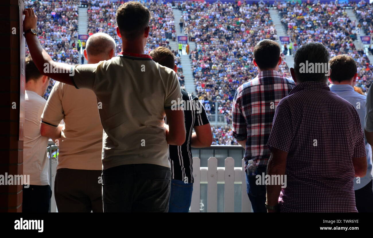 Spectators watch the West Indies v New Zealand cricket match on June 22, 2019, a match in the Cricket World Cup 2019 at Emirates Old Trafford, Manchester. The 2019  International Cricket Council (ICC) Cricket World Cup is being hosted by England and Wales from May 30th to July 14th, 2019. Six matches are being held at Old Trafford, Manchester, more than at any other venue. Stock Photo