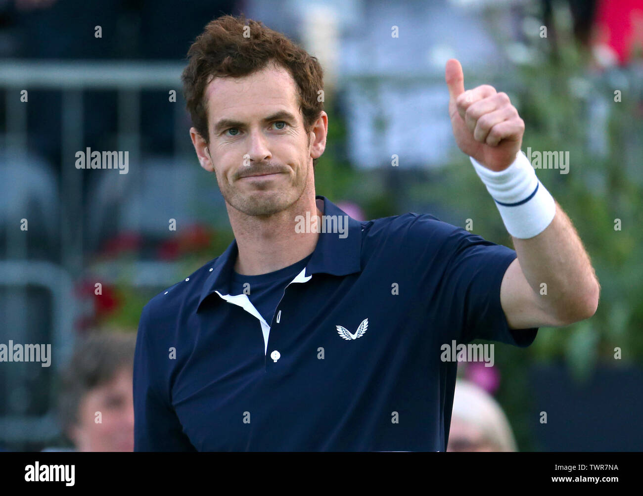 Andy Murray celebrates winning Men's Doubles Semi Final during day six