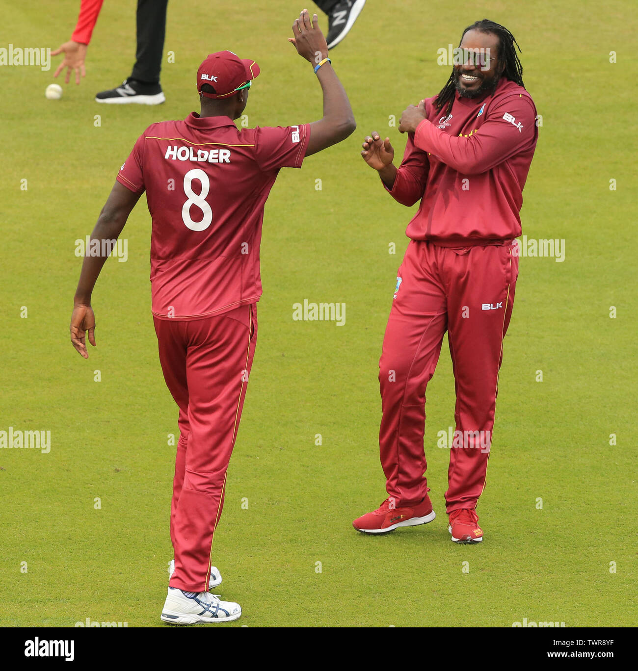 MANCHESTER, ENGLAND. 22 JUNE 2019: Chris Gayle of West Indies grabs his shoulder as he celebrates taking the wicket of Ross Taylor of New Zealand during the West Indies v New Zealand, ICC Cricket World Cup match, at Old Trafford, Manchester, England. Stock Photo