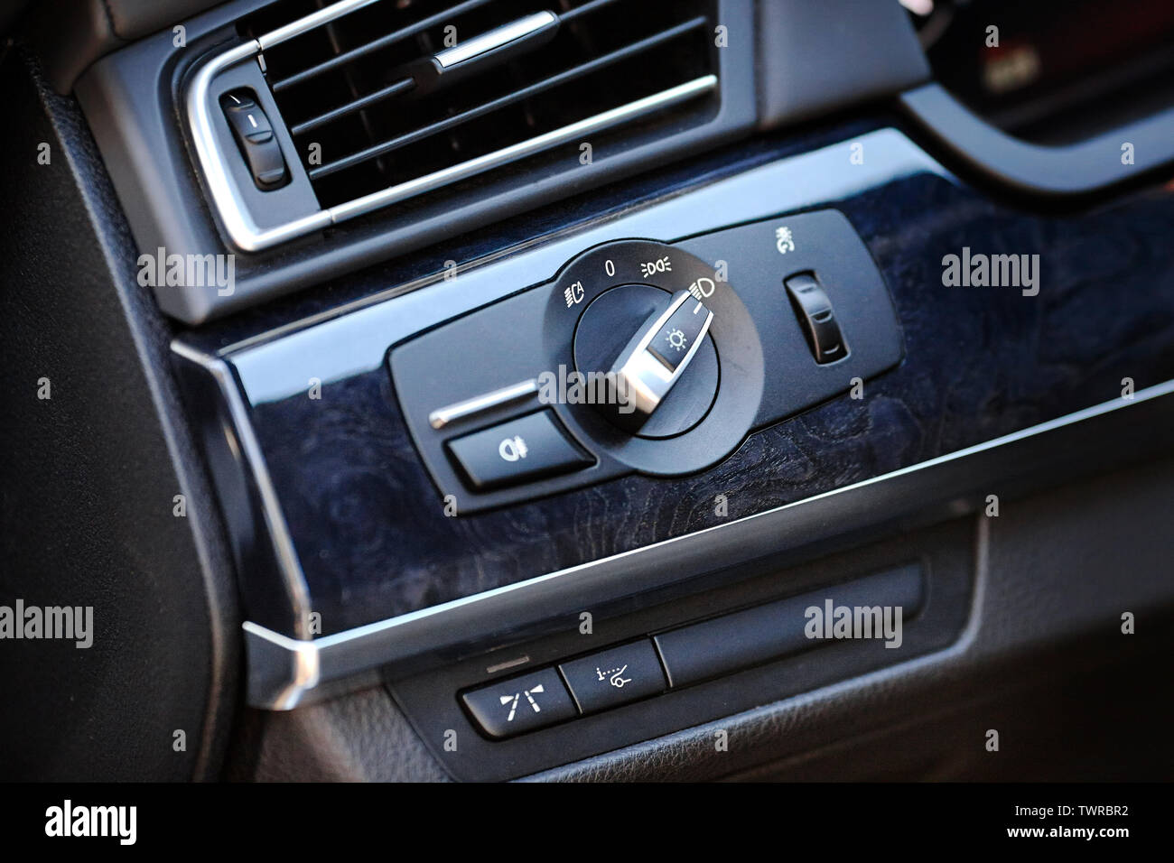 Element of modern luxury car interior switch for front headlights of car parking lights high beam dipped beam and information switch on windshield hea Stock Photo