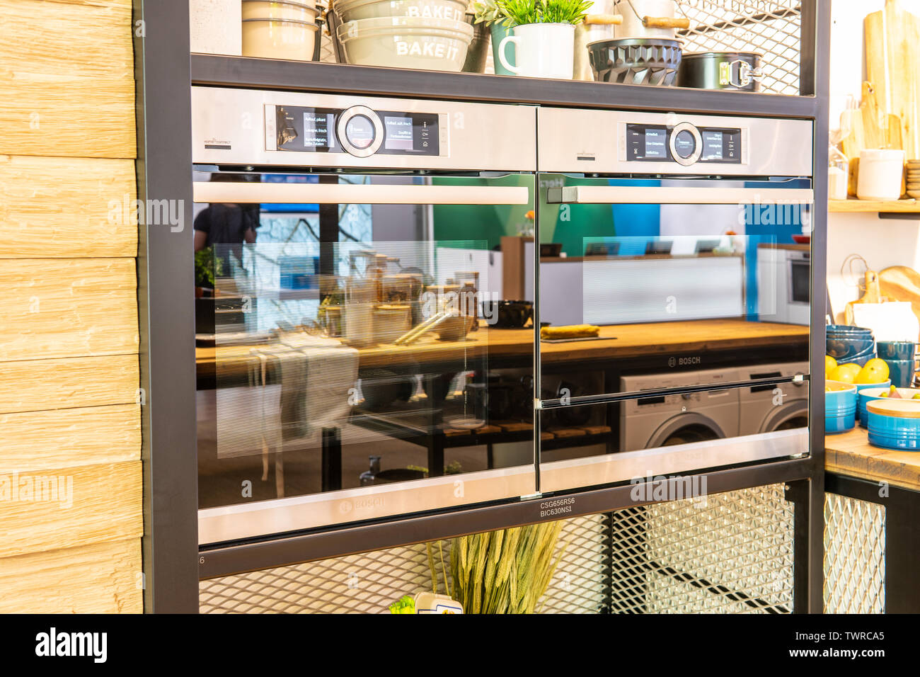 Bosch kitchen showroom with home appliances dishwasher, induction hobs