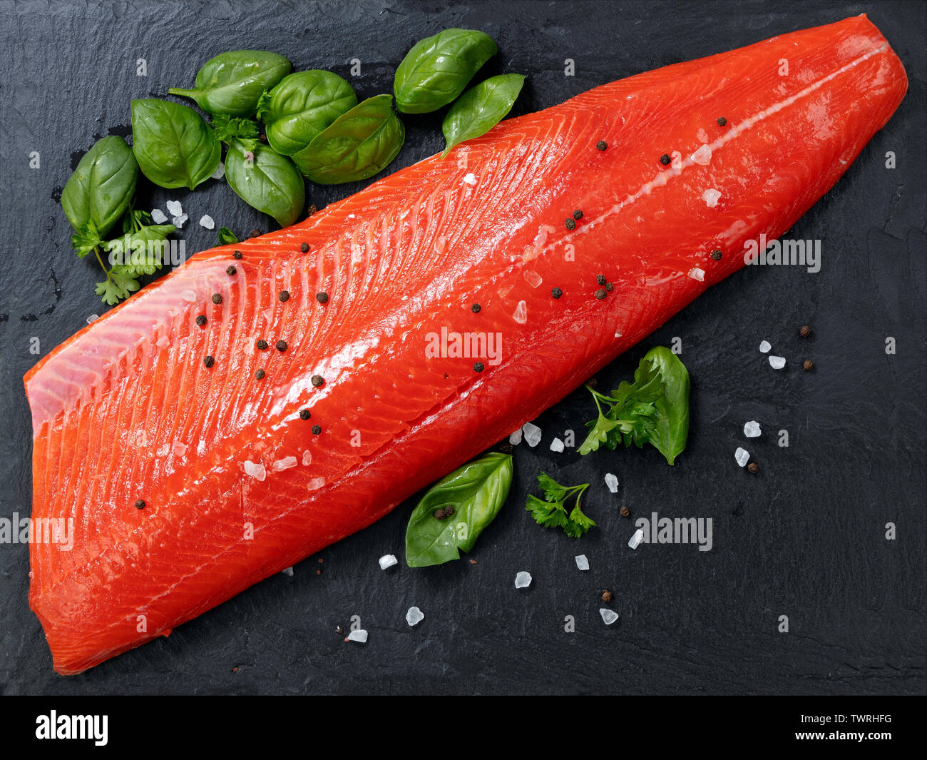 Fresh raw copper river sockeye salmon fillet on natural stone with