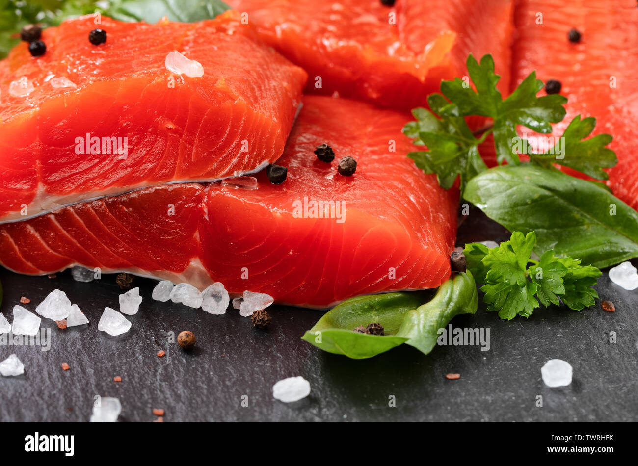 Fresh raw copper river sockeye salmon fillets on natural stone with