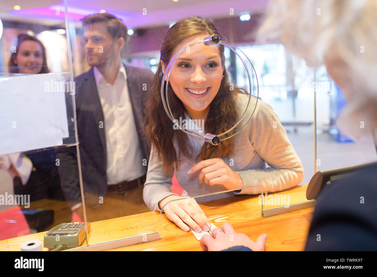 woman buying ticket in the ticket booth Stock Photo Alamy