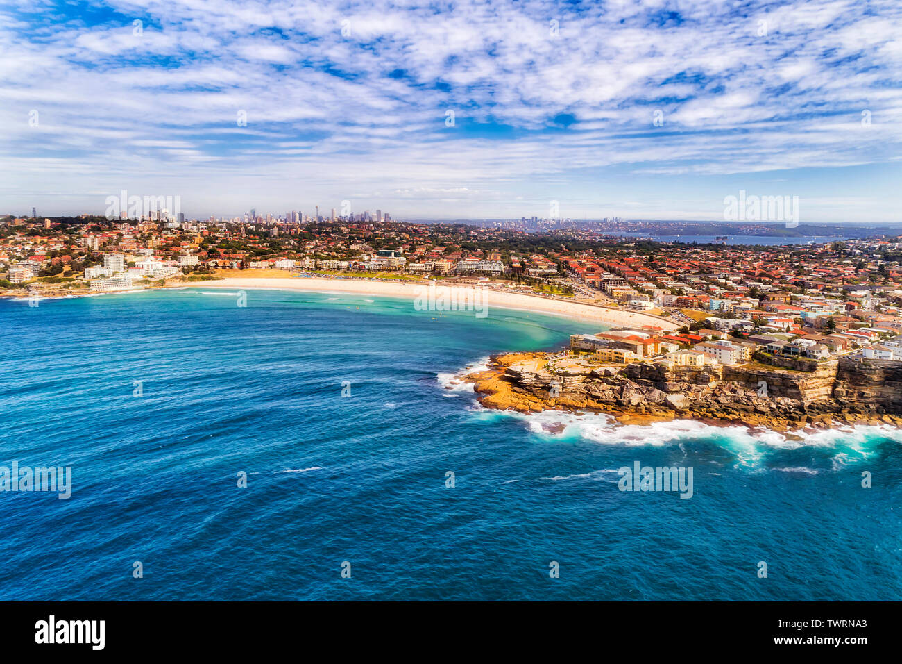 NOrth Bondi headland protecting Bondi beach from wild waves of Pacific ocean as popular famous destination in Sydney, Australia. Stock Photo