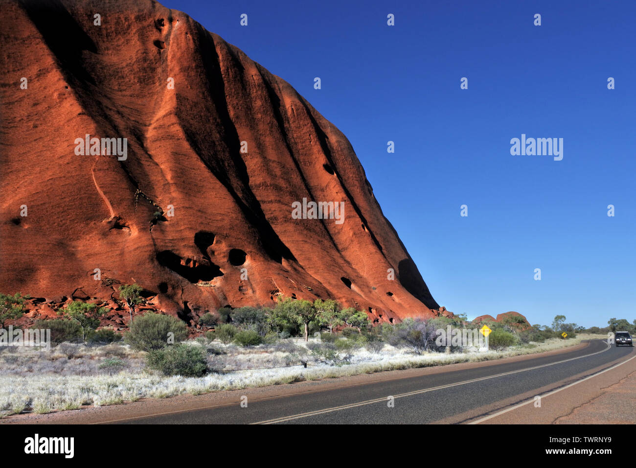 A Car Driving On A Road Along Uluru Ayers Rock In Uluru Kata Tjuta National Park Uluru Is Recognized As Australia S Most Natural Icon Stock Photo Alamy A Car Driving On A Road Along Uluru Ayers Rock In Uluru Kata Tjuta National Park Uluru Is Recognized As Australia S Most Natural Icon Stock Photo Alamy