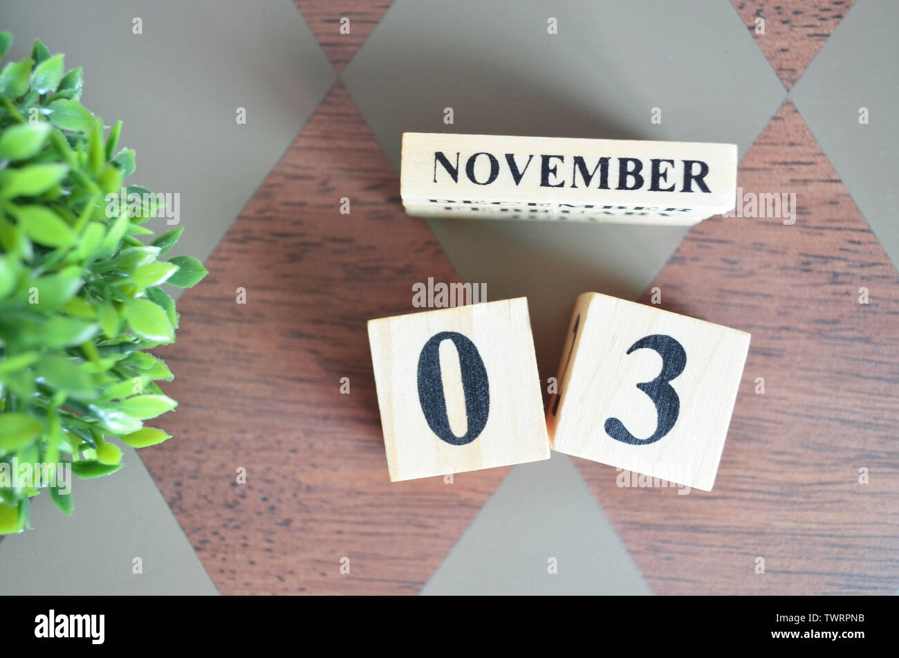 Nov Day Table Date of November with leaf on diamond pattern table for background ...