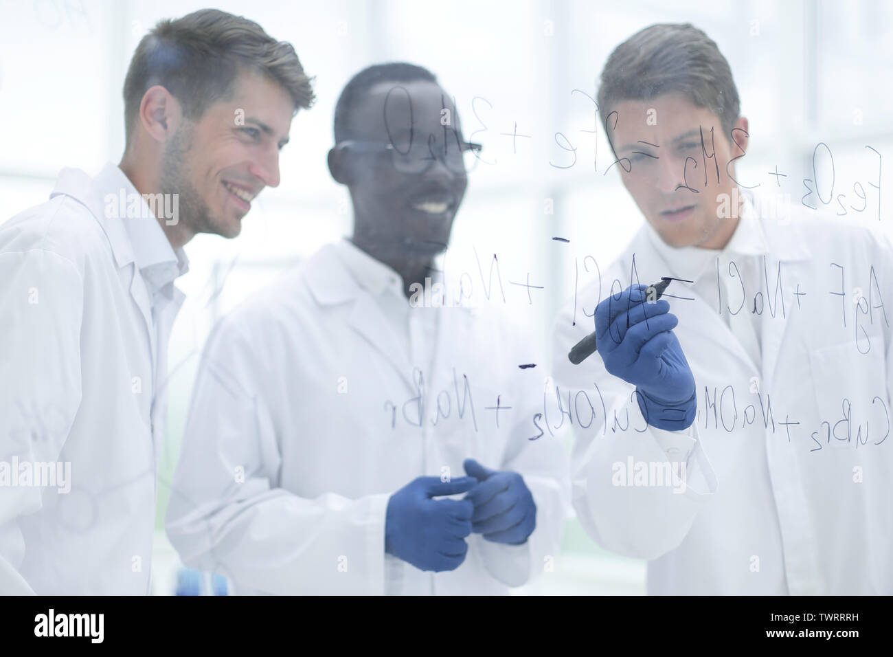 promising scientist makes notes on the Board Stock Photo