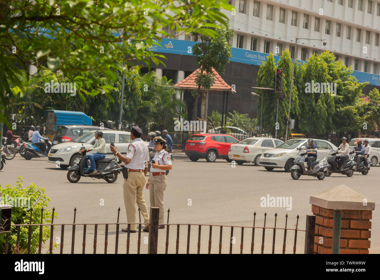 Bangalore, Karnataka India-June 04 2019 :Moving Traffic near town hall circle and City traffic police busy at work in Bengalore Stock Photo