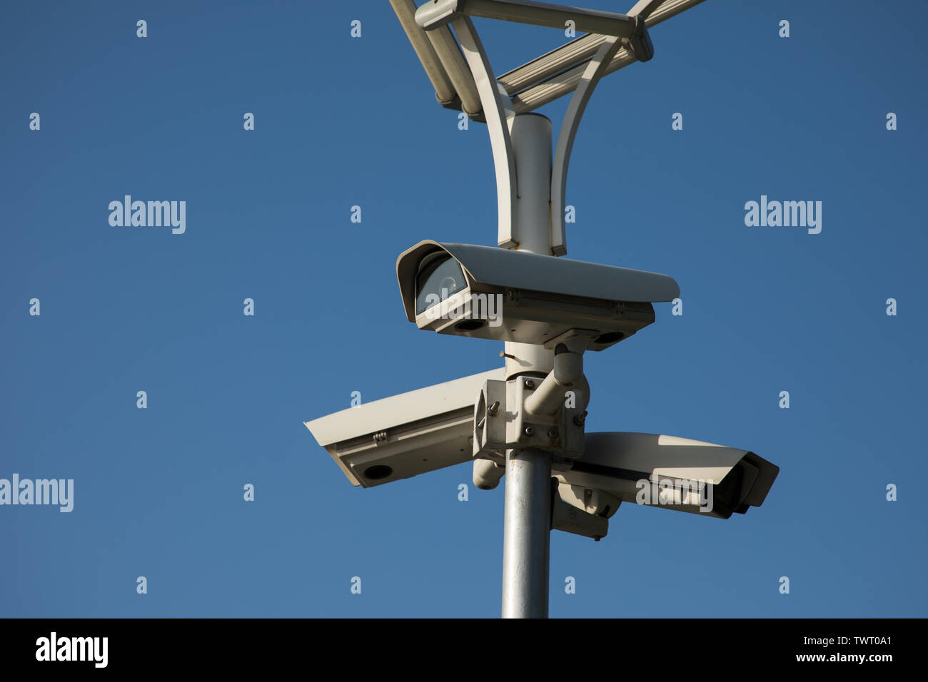 Security camera record live, Security camera on blue sky background. Stock Photo