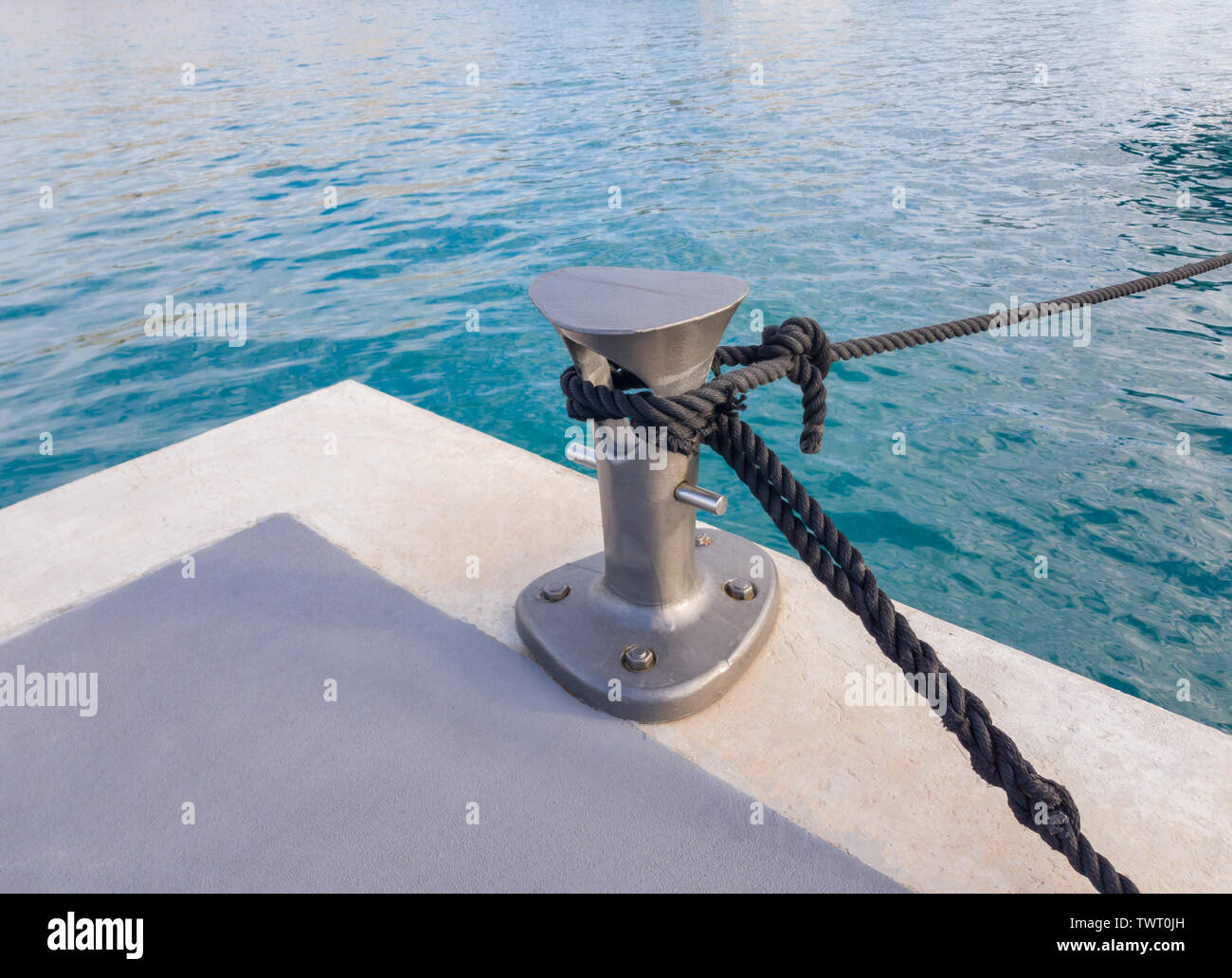 Modern small bitt for mooring on the dock Stock Photo - Alamy
