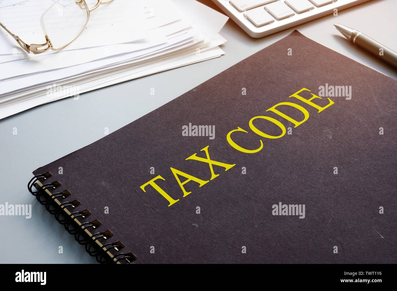 Tax code and financial documents in the office. Stock Photo