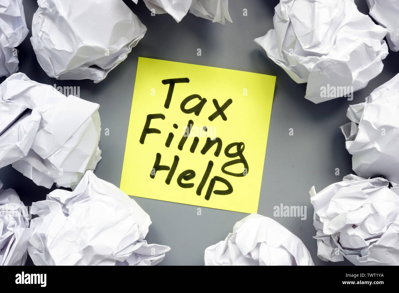 Tax filing help sign and paper balls. Stock Photo