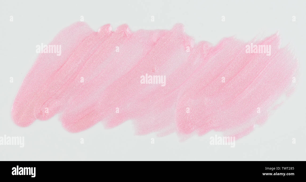 Sparkle light pink paint stain isolated on white background close up
