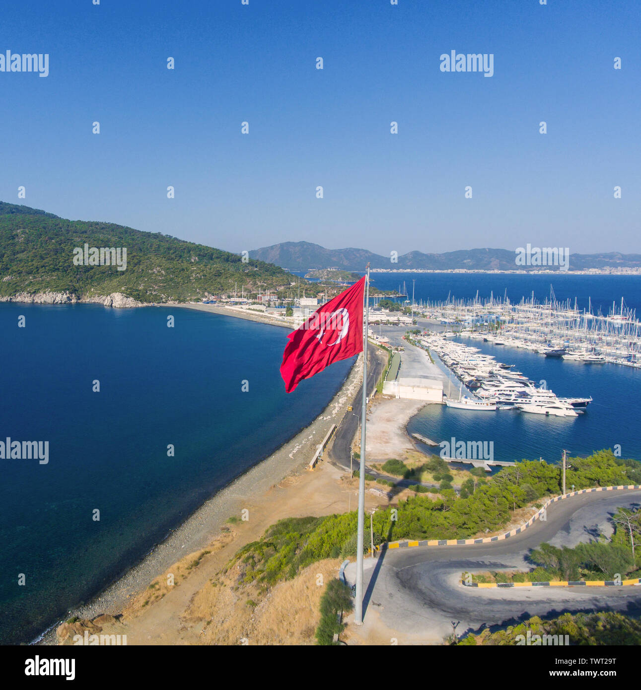 Aerial view of the marina and Turkish flag. Seaside Turkish landscape ...