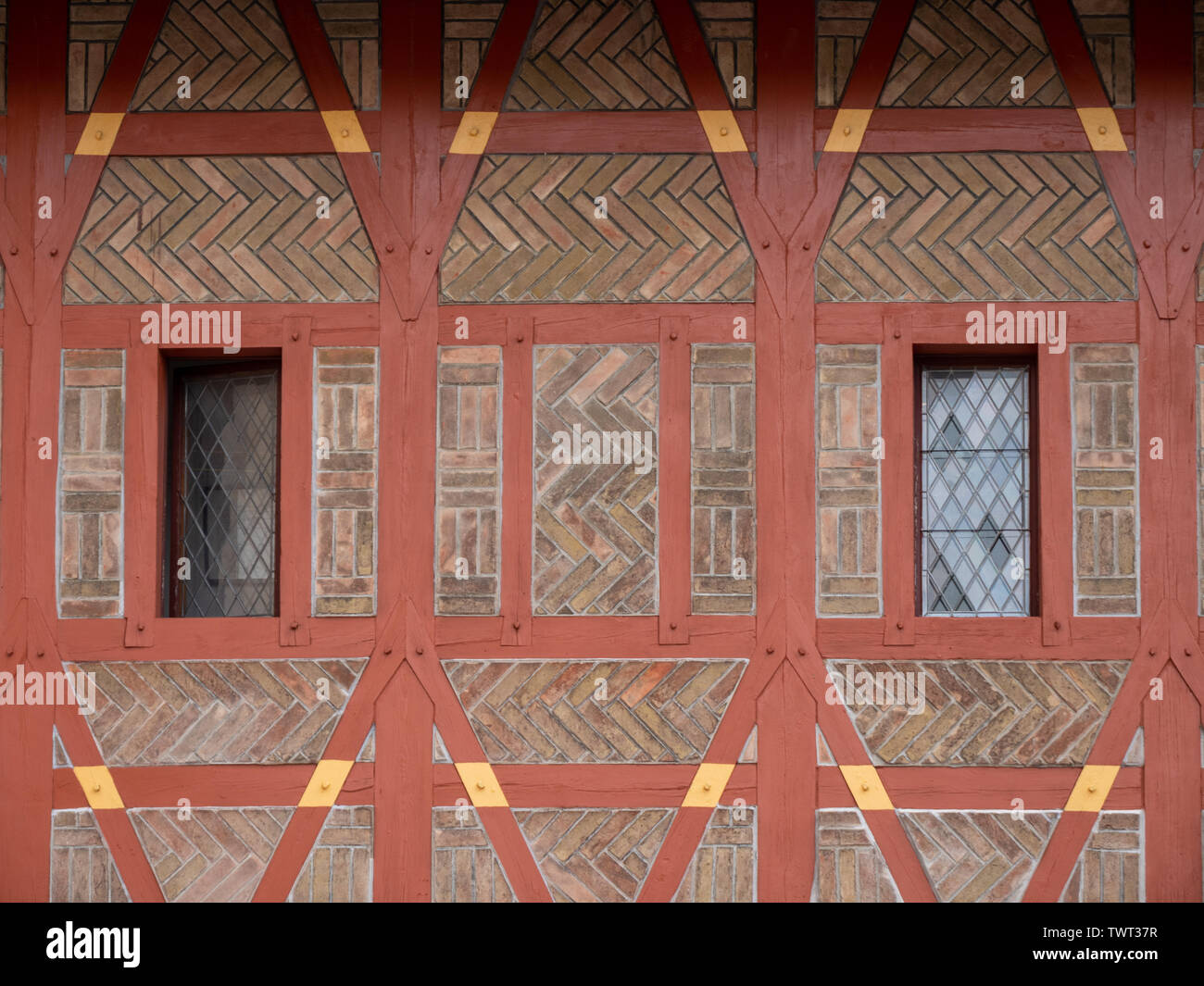 Detail of Gothic Half-Timbered Burgrave's House on Karlstejn Castle or Karluv Tyn in Bohemia Czech Republic. A Red Brick Facade with Wooden Timbering. Stock Photo