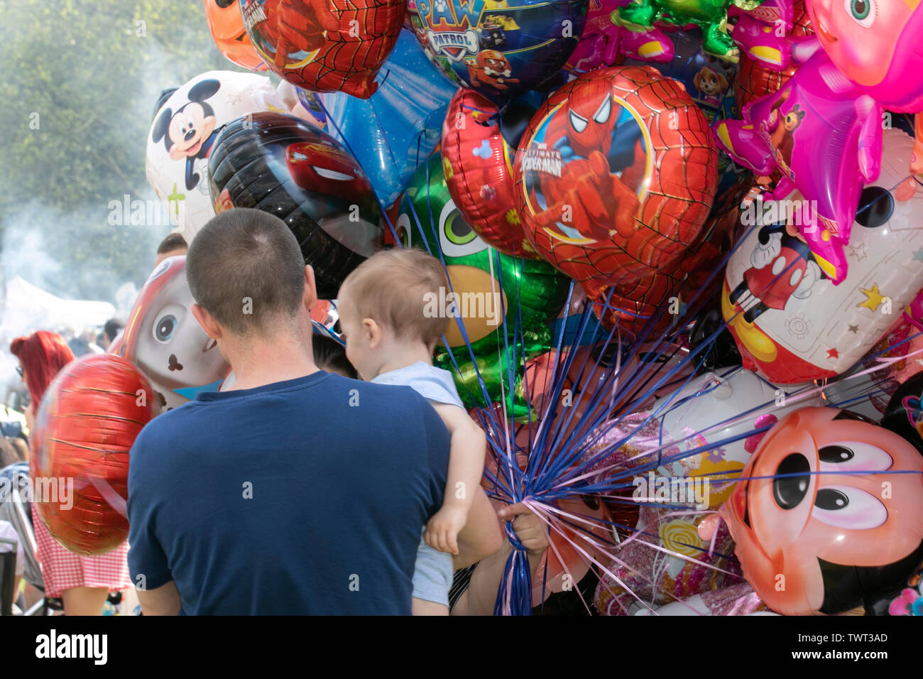 Vendor selling helium balloons at Music Festival, Liverpool, UK Stock Photo  - Alamy