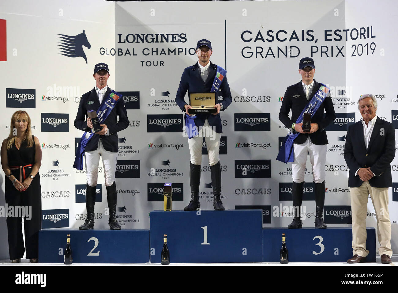 Cascais, Portugal. 22nd June, 2019. Martin Fuchs of Switzerland (C), Ben Maher of United Kingdom (2nd L) and Michael Duffy of Ireland (2nd R) pose on the podium during the awarding ceremony of the Cascais Estoril jumping competition of Longines Global Champions Tour Grand Prix in Cascais, Portugal, on June 22, 2019. Credit: Petro Fiuza/Xinhua/Alamy Live News Stock Photo