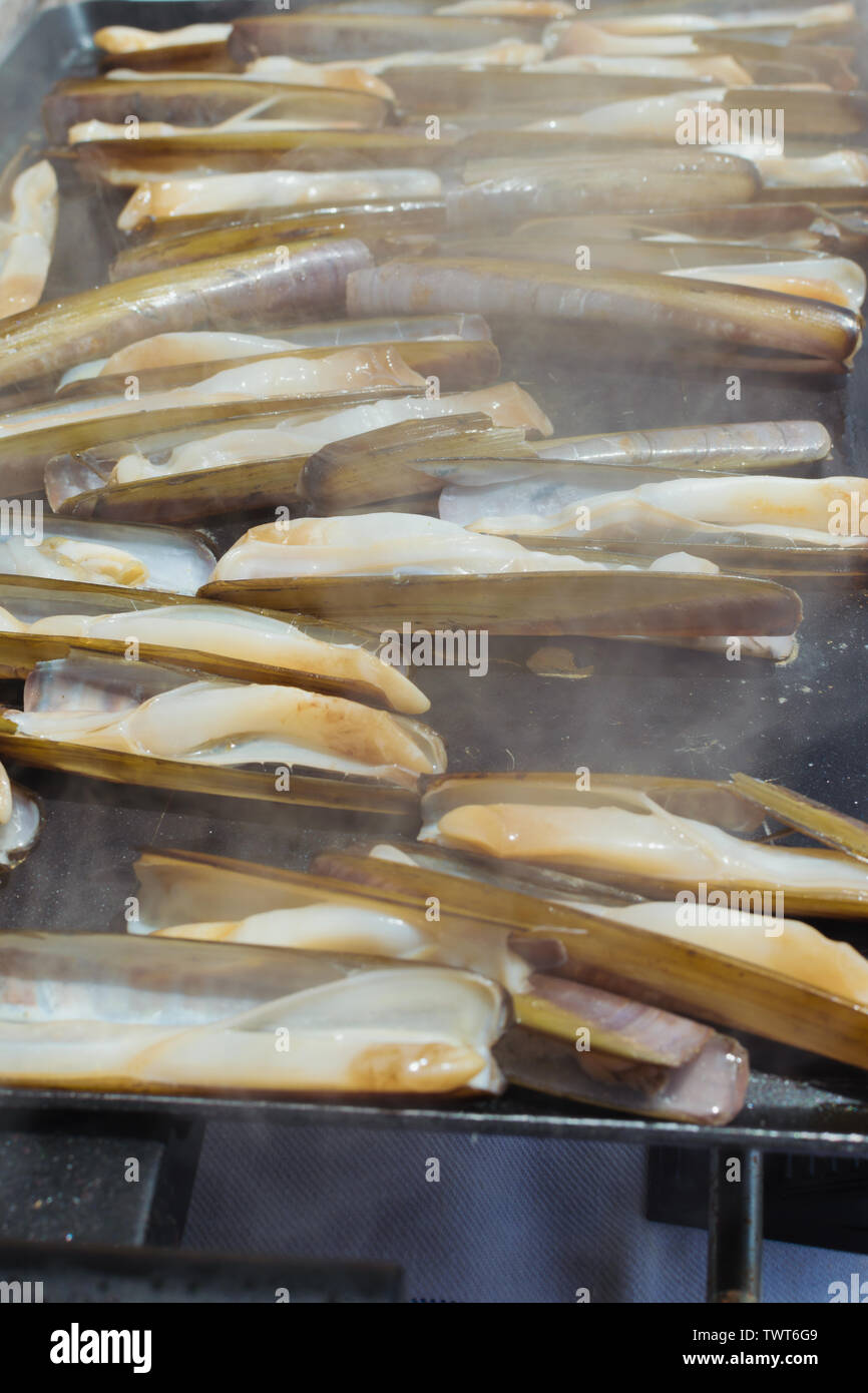 delicious razor shell seafood grilled outdoors Stock Photo - Alamy