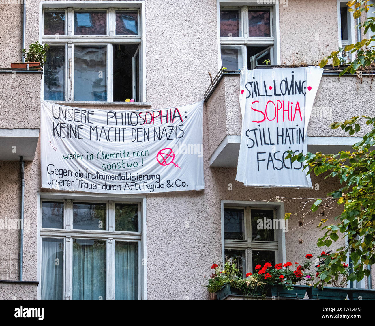 Antiifascist, Anti-racist, Anti-Nazi banners on front of apartment building in Friedrichshain-Berlin Stock Photo