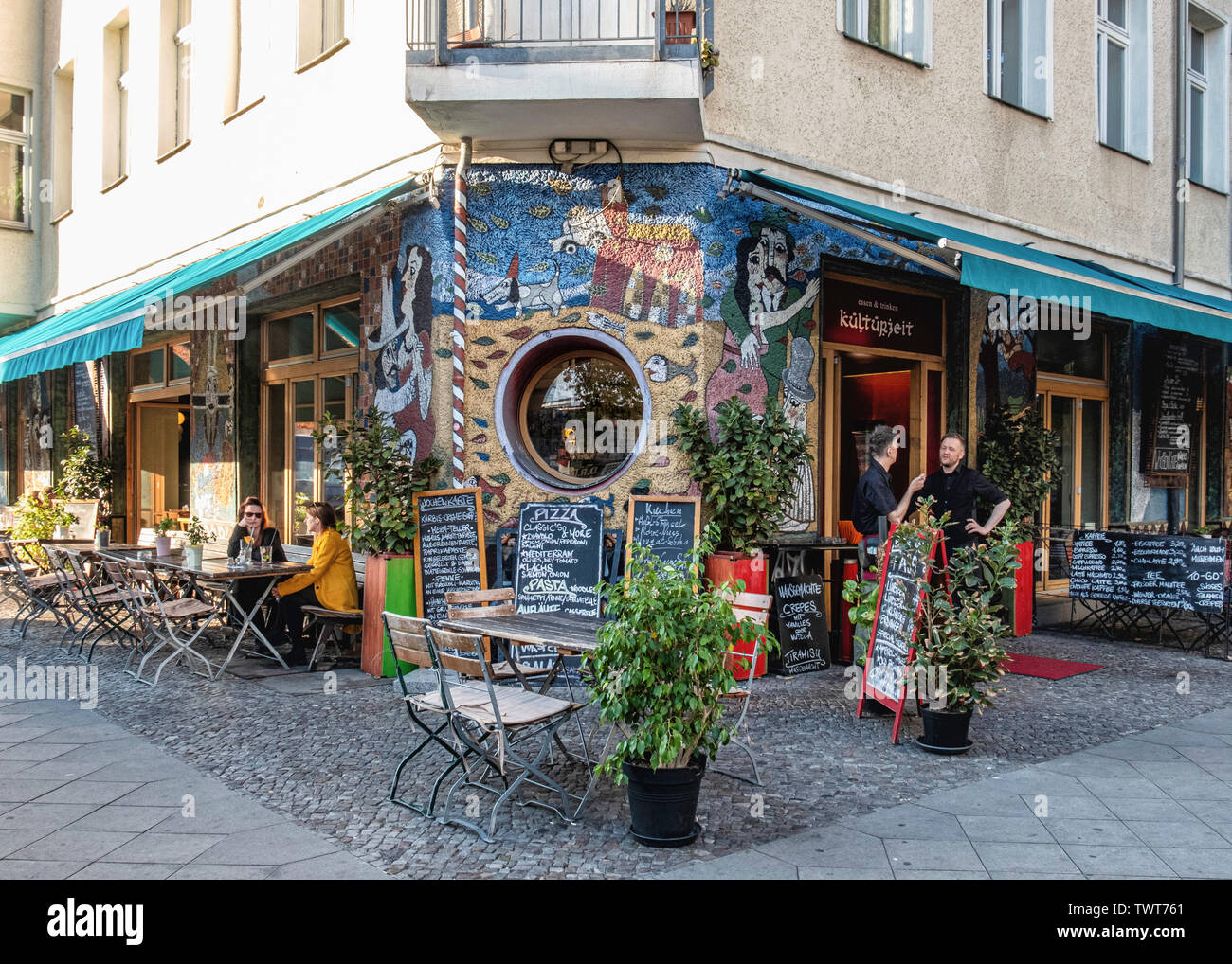 Kulturzeit restaurant with outdoor chairs & tables in Simon Dach Strasse, Friedrichshain Berlin
