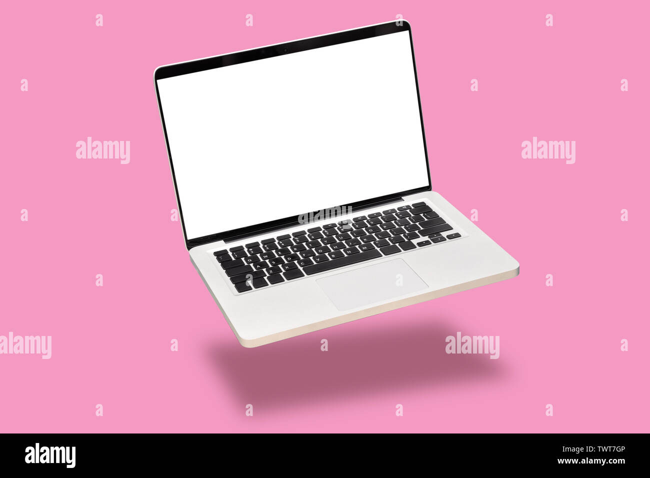 laptop computer mock up with empty blank white screen isolated on pink background. float or levitate laptop notebook with shadow. modern computer tech Stock Photo