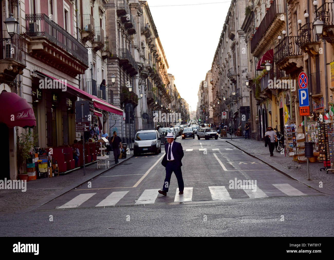 Man crossing a road in Catania City Stock Photo