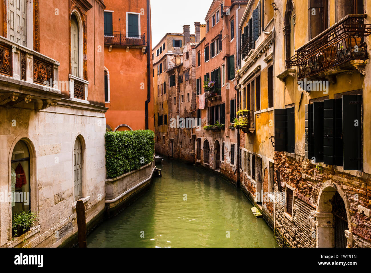 Decrepit beauty of the canals and buildings in Venice, Italy Stock Photo