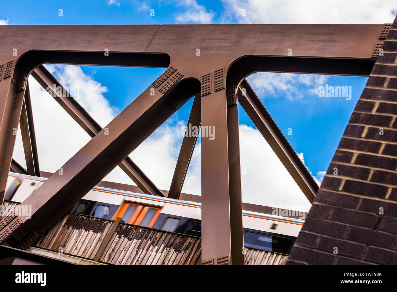 Dynamic view of a train passing at speed on the GE19 Bridge, Shoreditch, London, UK Stock Photo