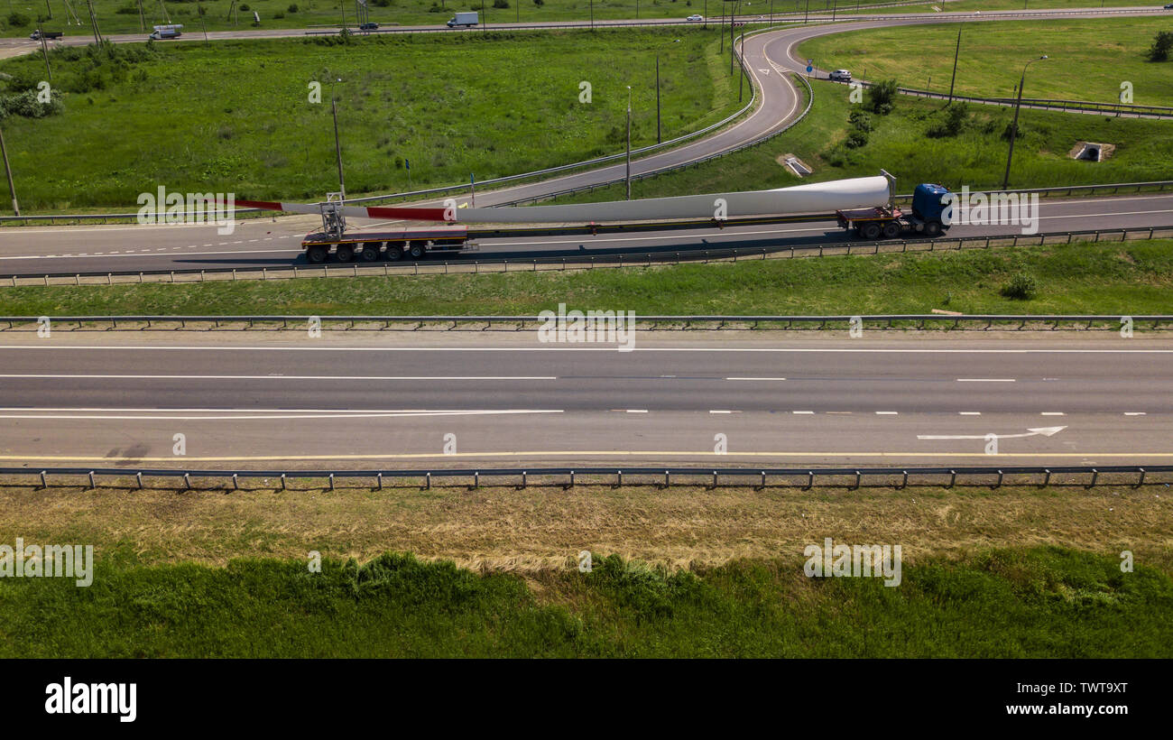Aerial view of modern highway road intersection on rural landscape ...