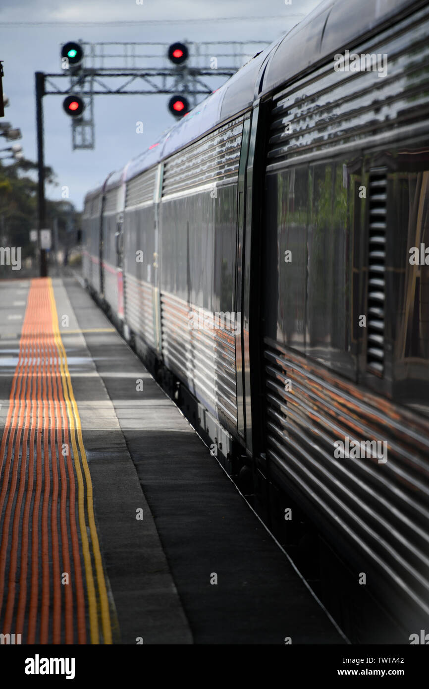 Train at Station with Distant Signals Stock Photo