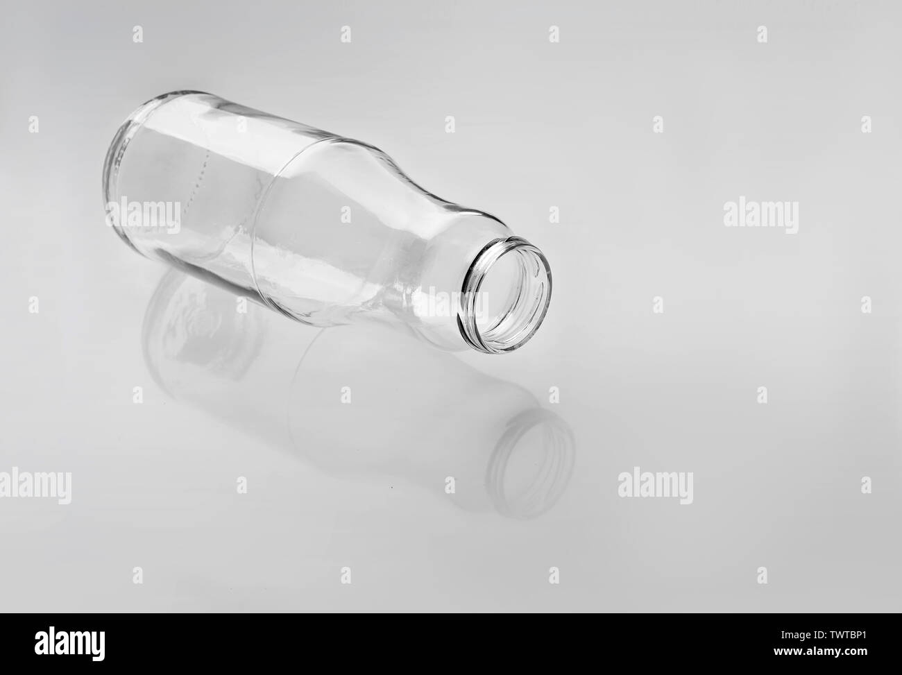Empty glass bottle for drinks milk, juice, water on a white background. Stock Photo
