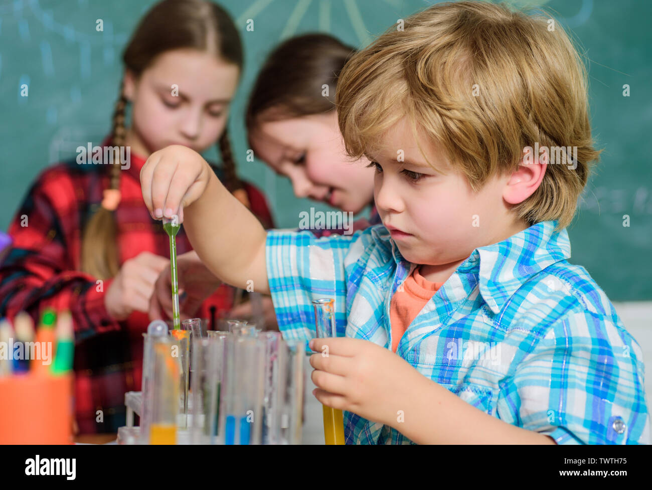 Laboratory Research - Scientific project For Chemical test. Science and education. chemistry lab. happy children. back to school. School chemistry laboratory. Working together to prepare for finals. Stock Photo